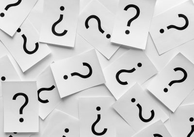 Background texture of printed question marks